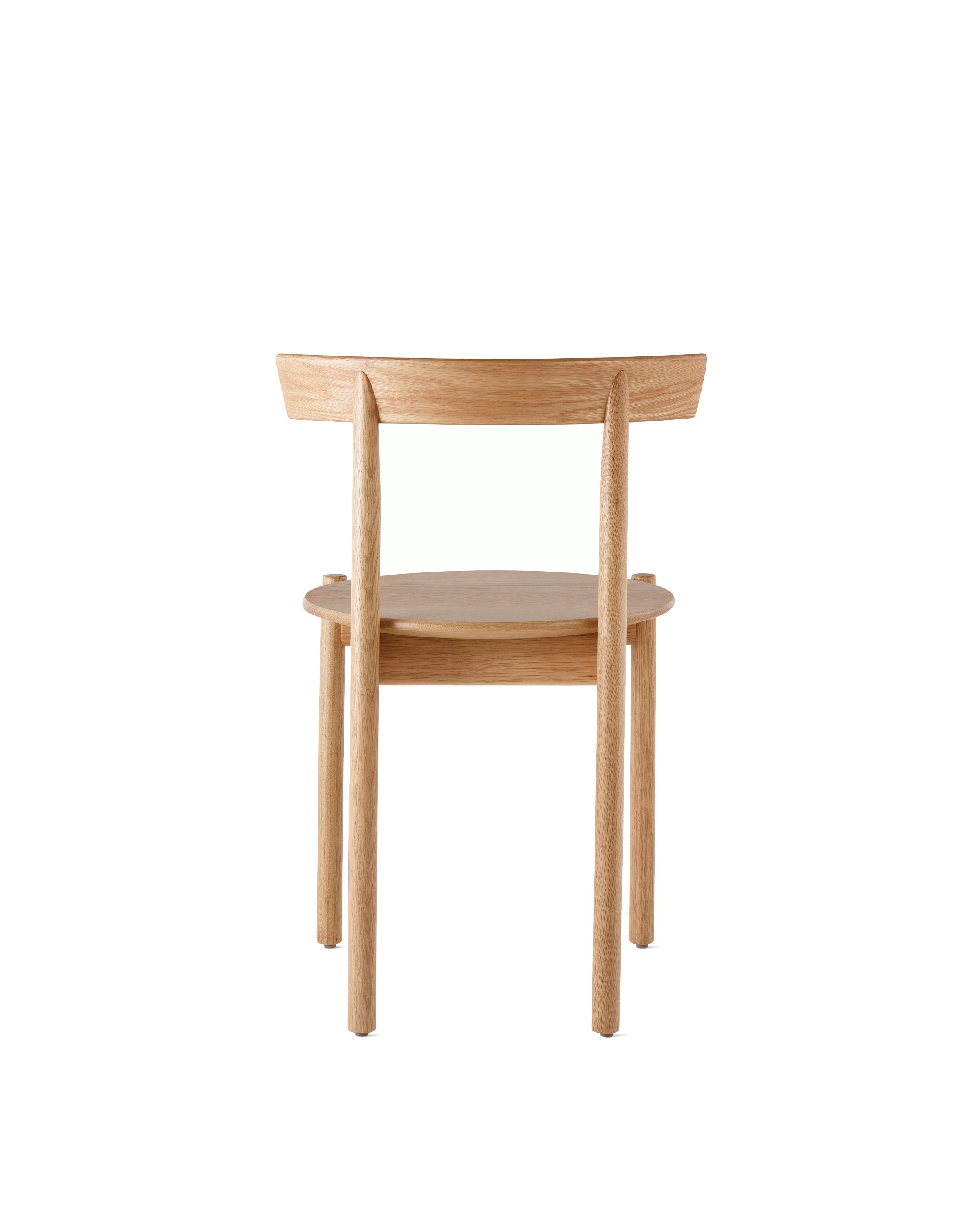 An oak Comma Chair, viewed from the back.