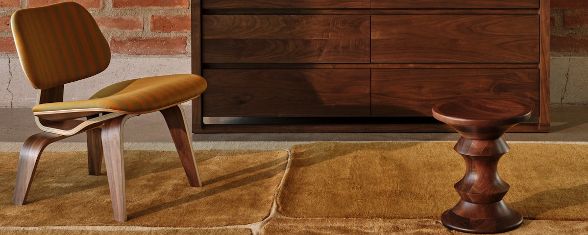 Province Rug, Matera Dresser, and Eames Molded Plywood LCW in a living room setting