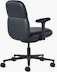 Rear angle view of a mid-back Asari chair by Herman Miller in black leather with height adjustable arms.