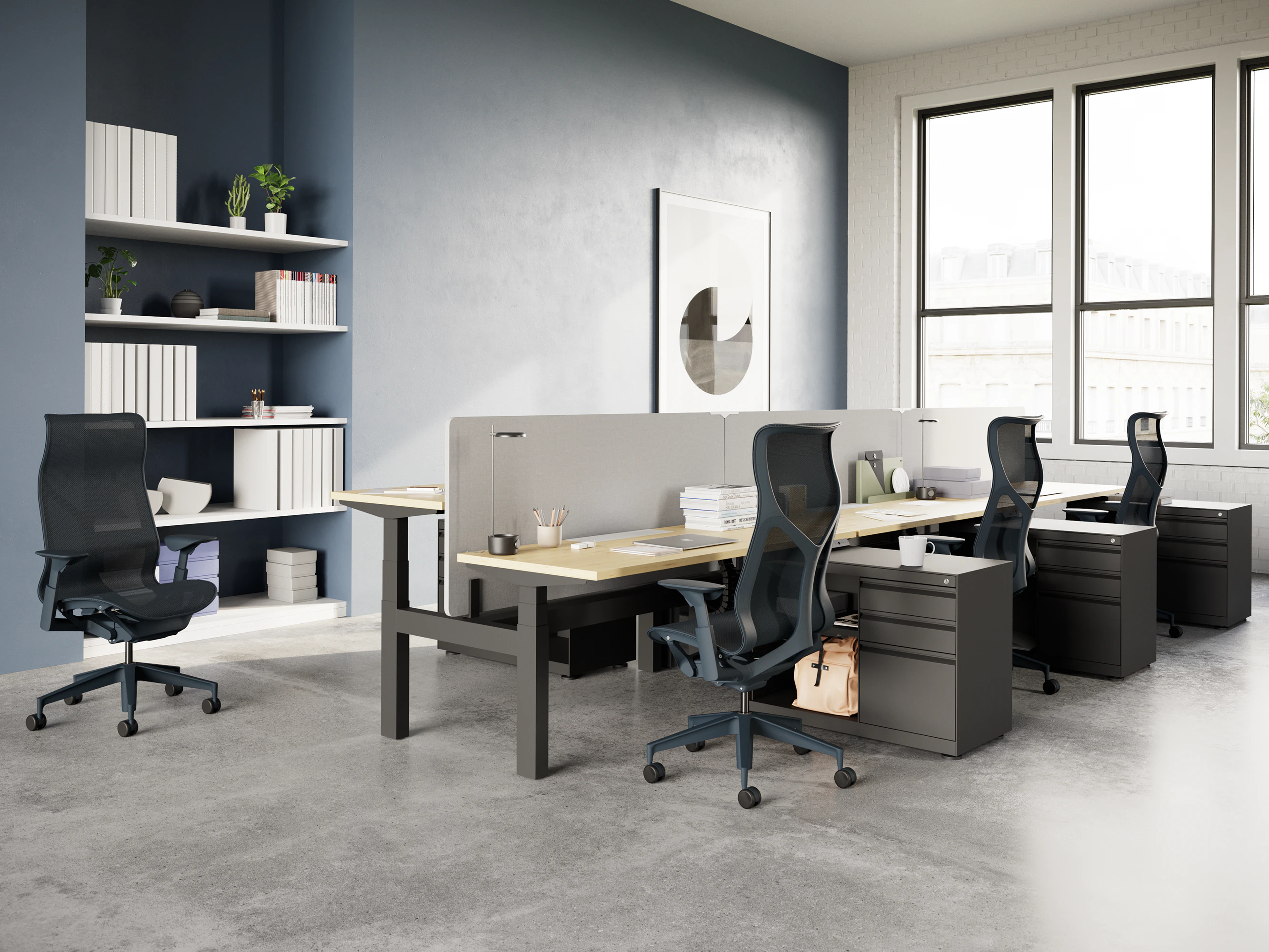 Cosm Chairs with height-adjustable arms in a workstation with height-adjustable tables.