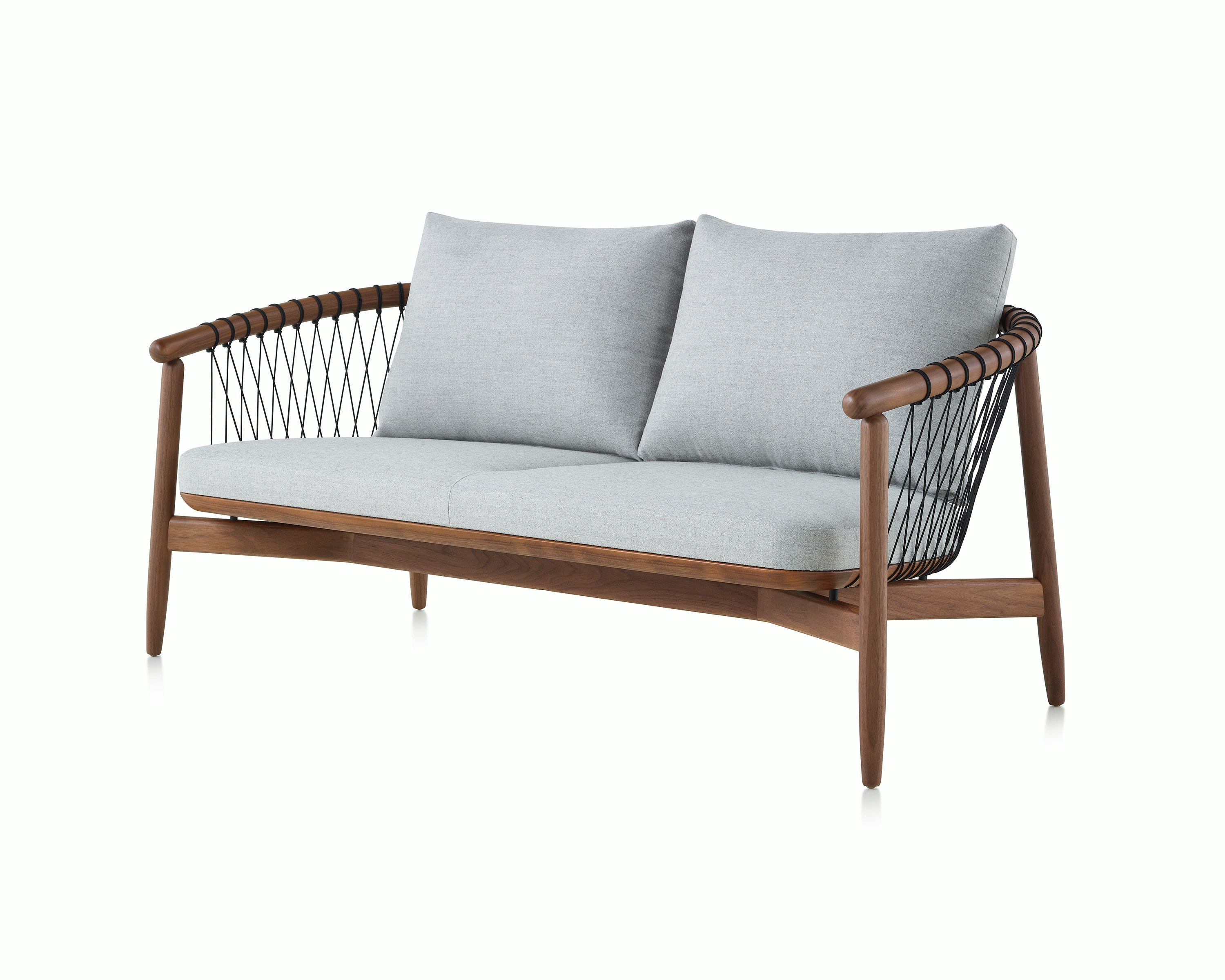 A Crosshatch Settee with a walnut frame, black cords, and a light neutral fabric, viewed at an angle.