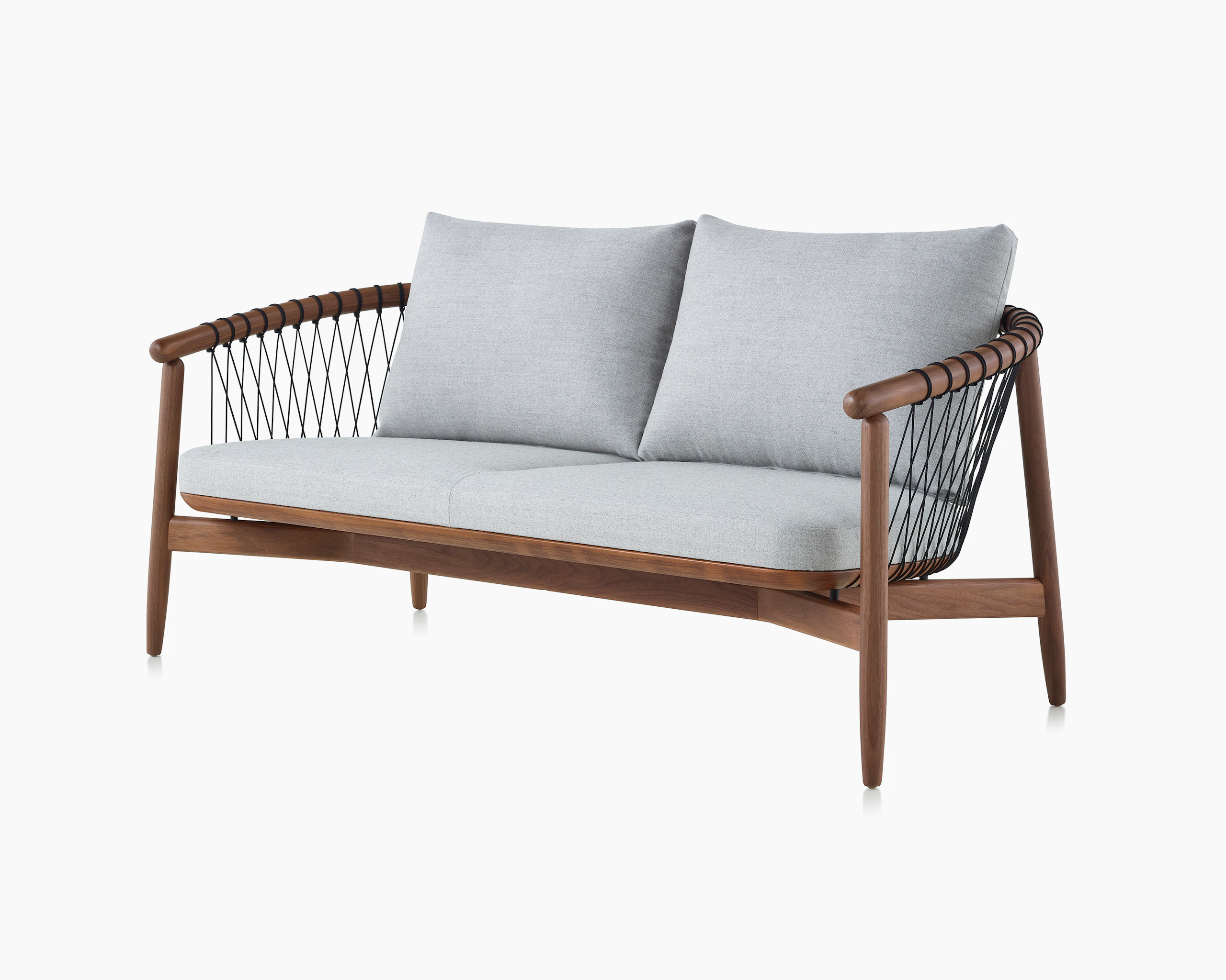 A Crosshatch Settee with a walnut frame, black cords, and a light neutral fabric, viewed at an angle.