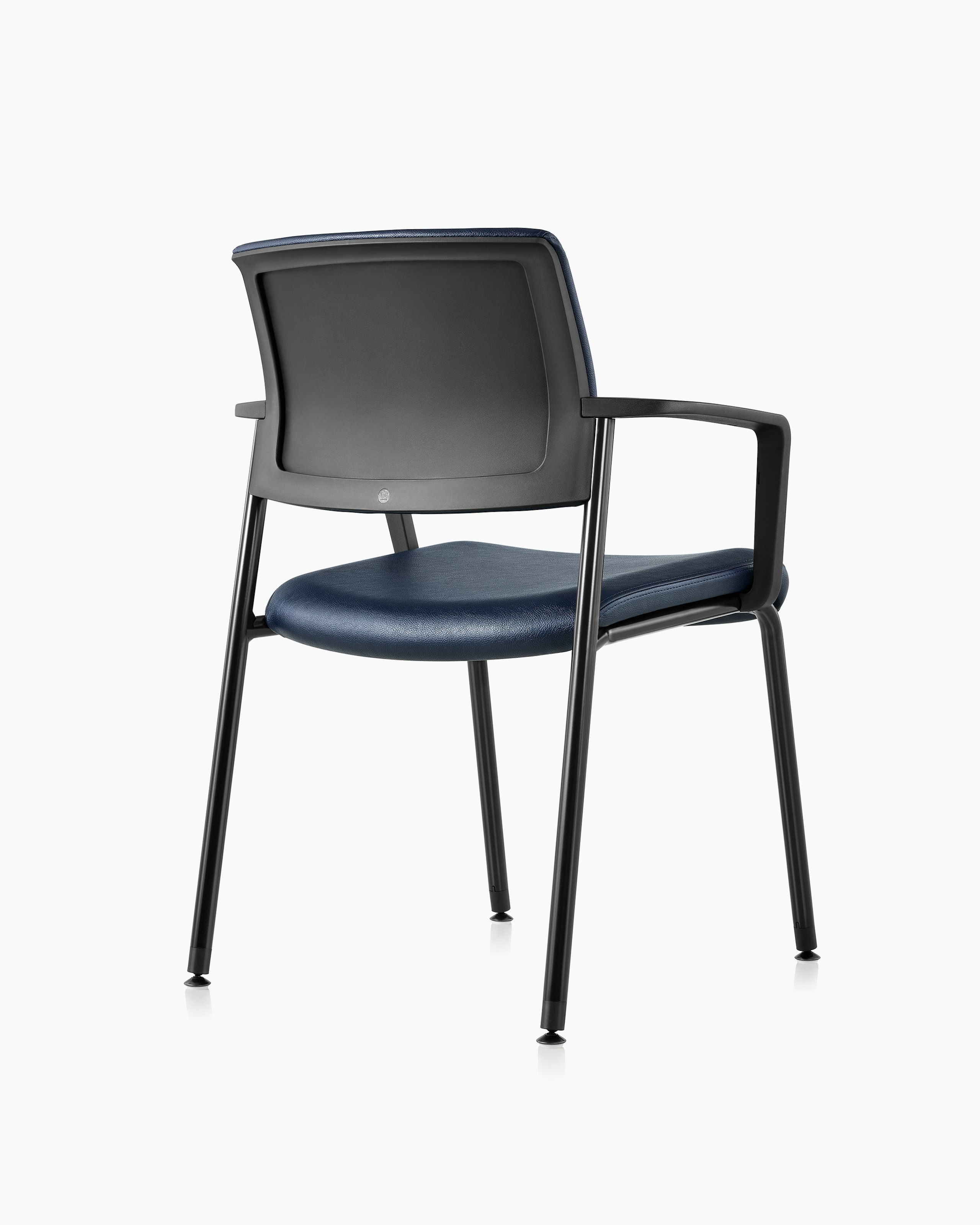 Three quarter view, right, of the Verus Side Chair with arms, in blue vinyl upholstery.