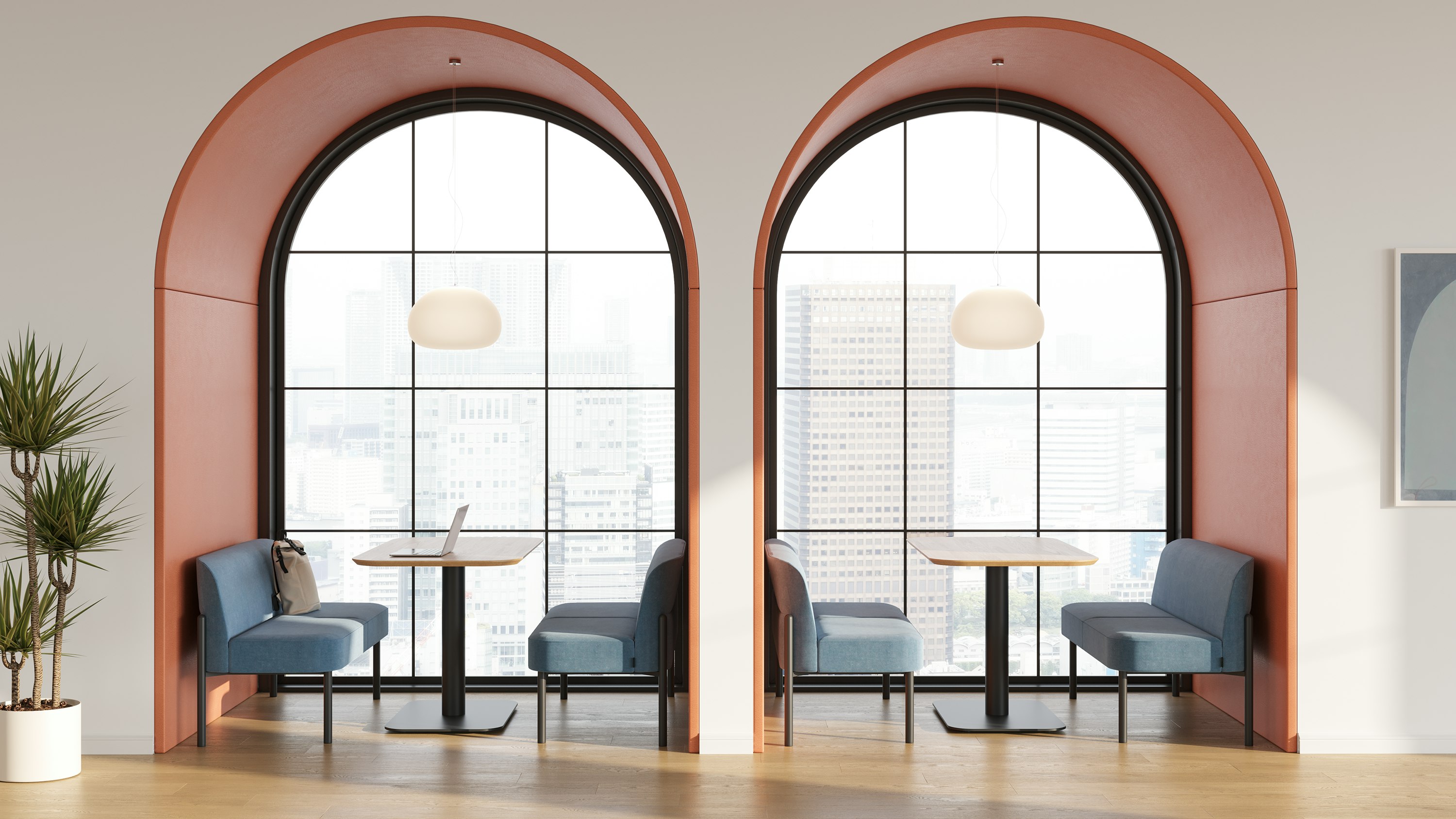 Hue sofas and tables positioned in two archways.