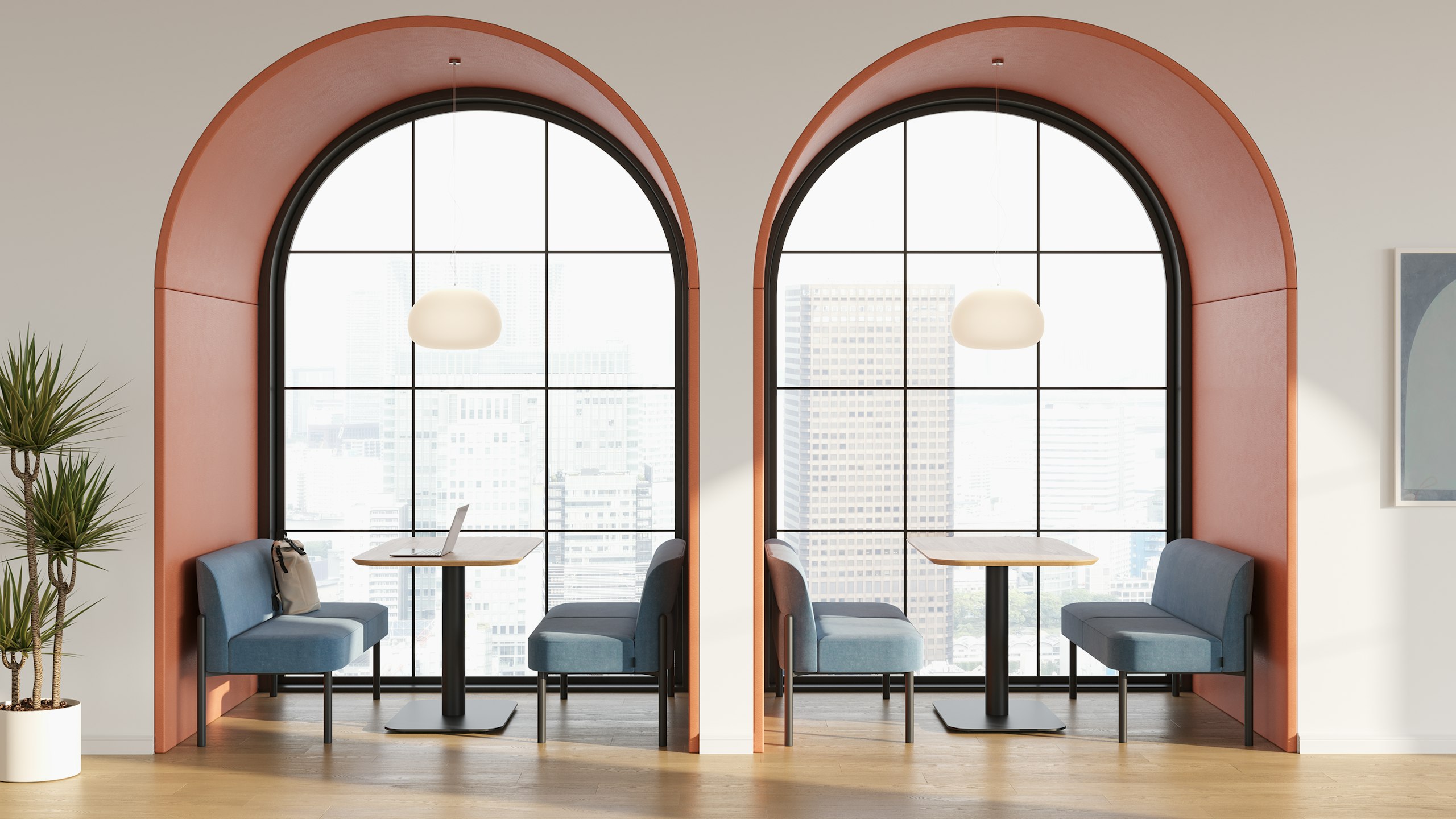 Hue sofas and tables positioned in two archways.