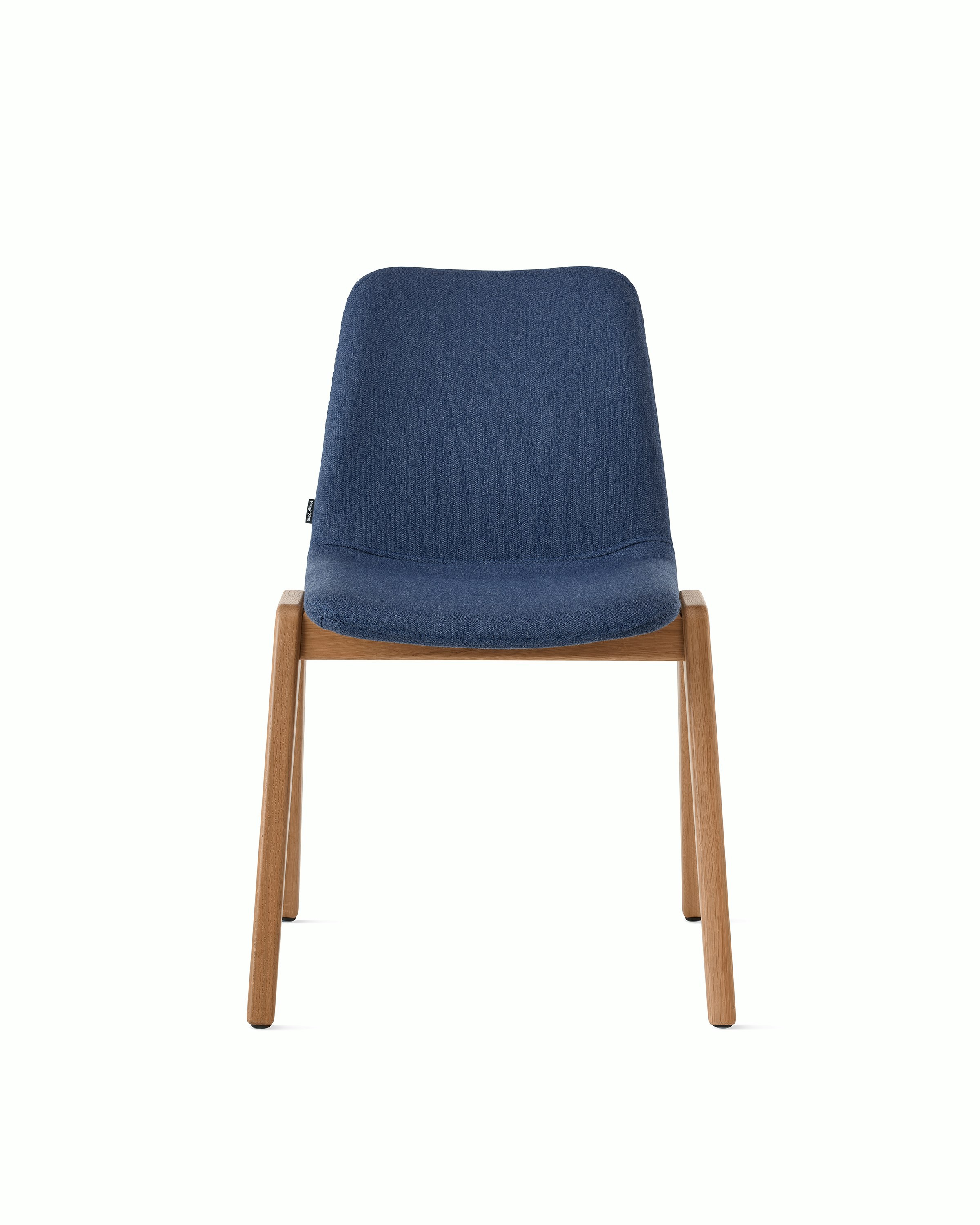 White sweep of Viv wood chair with dark blue fabric and 4 leg solid oak wood base