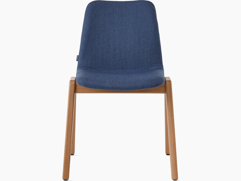 White sweep of Viv wood chair with dark blue fabric and 4 leg solid oak wood base