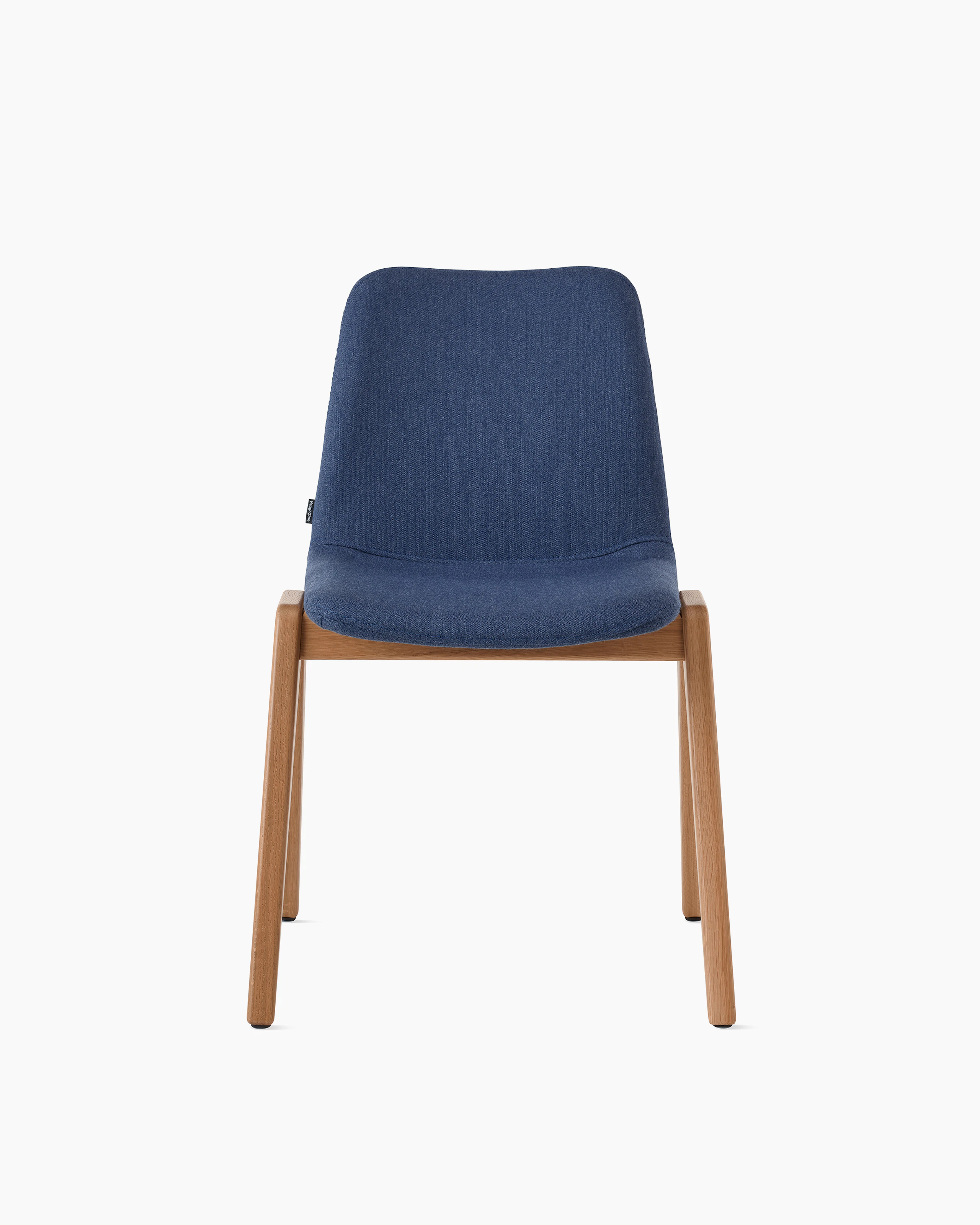 White sweep of Viv wood chair with dark blue fabric and 4 leg solid oak wood base