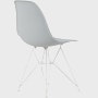 Back angle of light grey plastic shell chair on wire base.