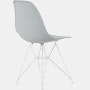 Back angle of light grey plastic shell chair on wire base.