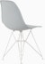 Back angle of light grey plastic shell chair on wire base.