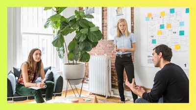 A discussion among colleagues in a casual setting.