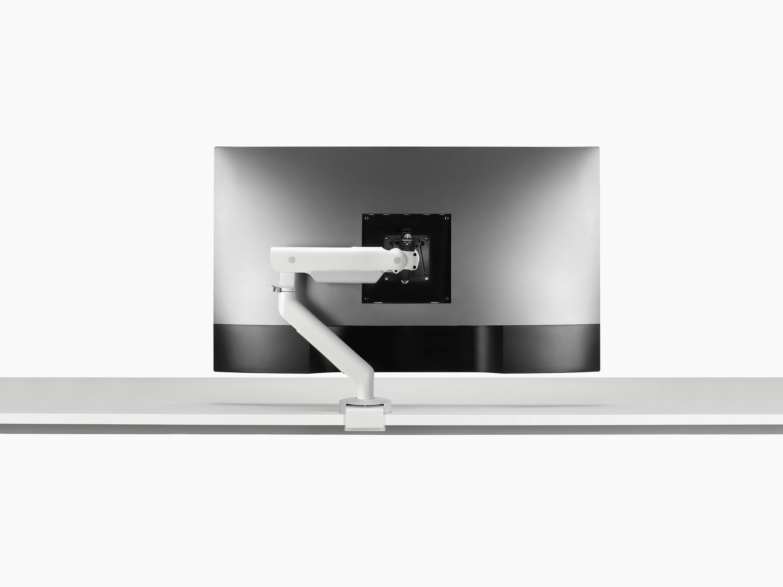 White single Flo X arm with a 43'' screen, viewed from the back