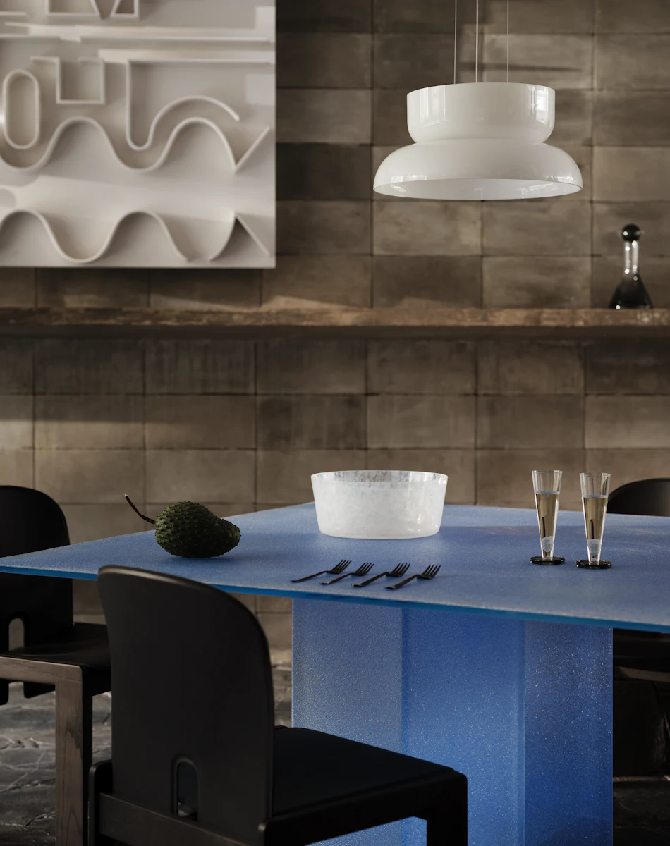 Blue table with single central pedestal viewed from front
