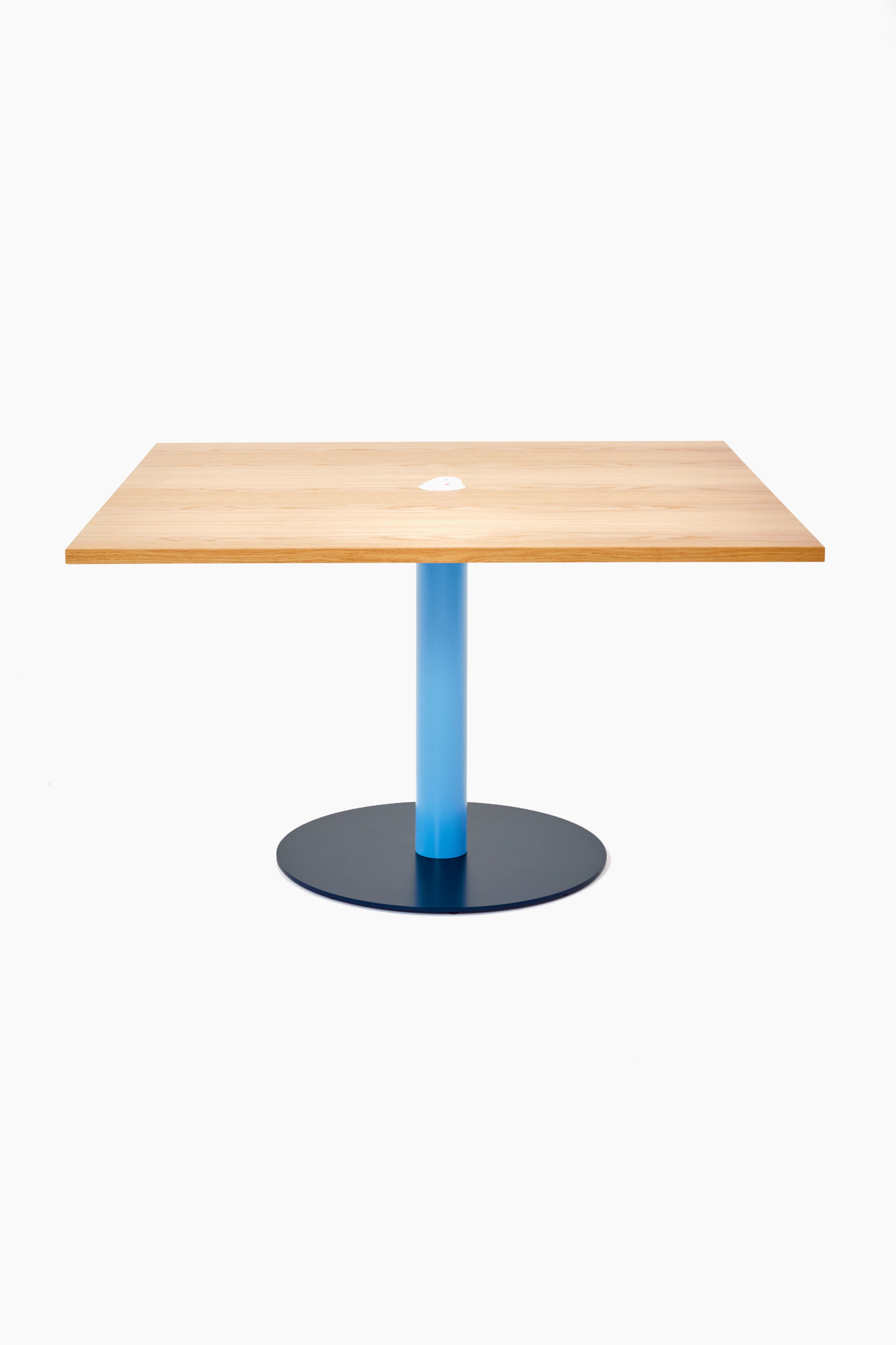 Front view of a square Tier table with Oak veneer top, Pastel Blue stem and Steel Blue base.