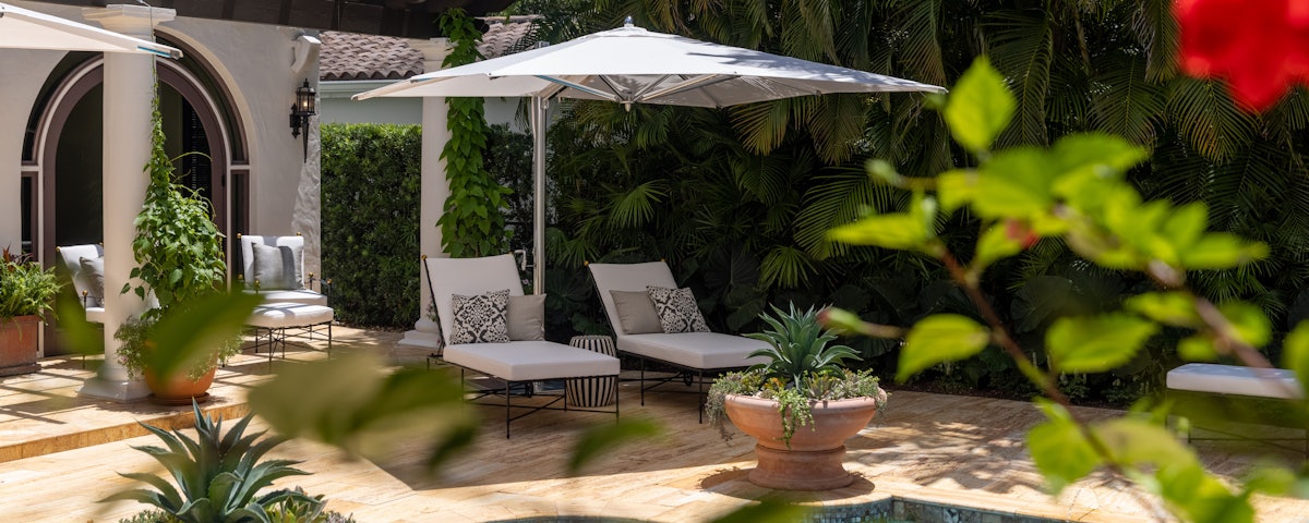 Tuuci Ocean Master Max Classic Square Cantilever Umbrella in a poolside setting