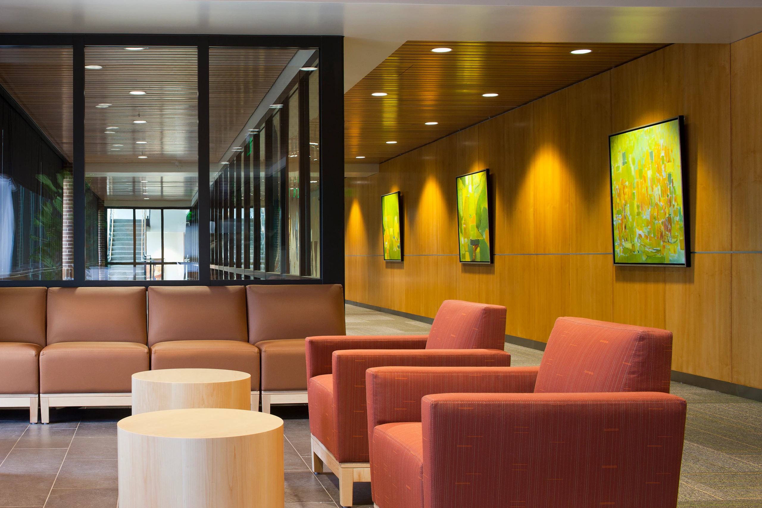 A waiting area with Nemschoff Brava Platform Chairs and Cylinder Tables.
