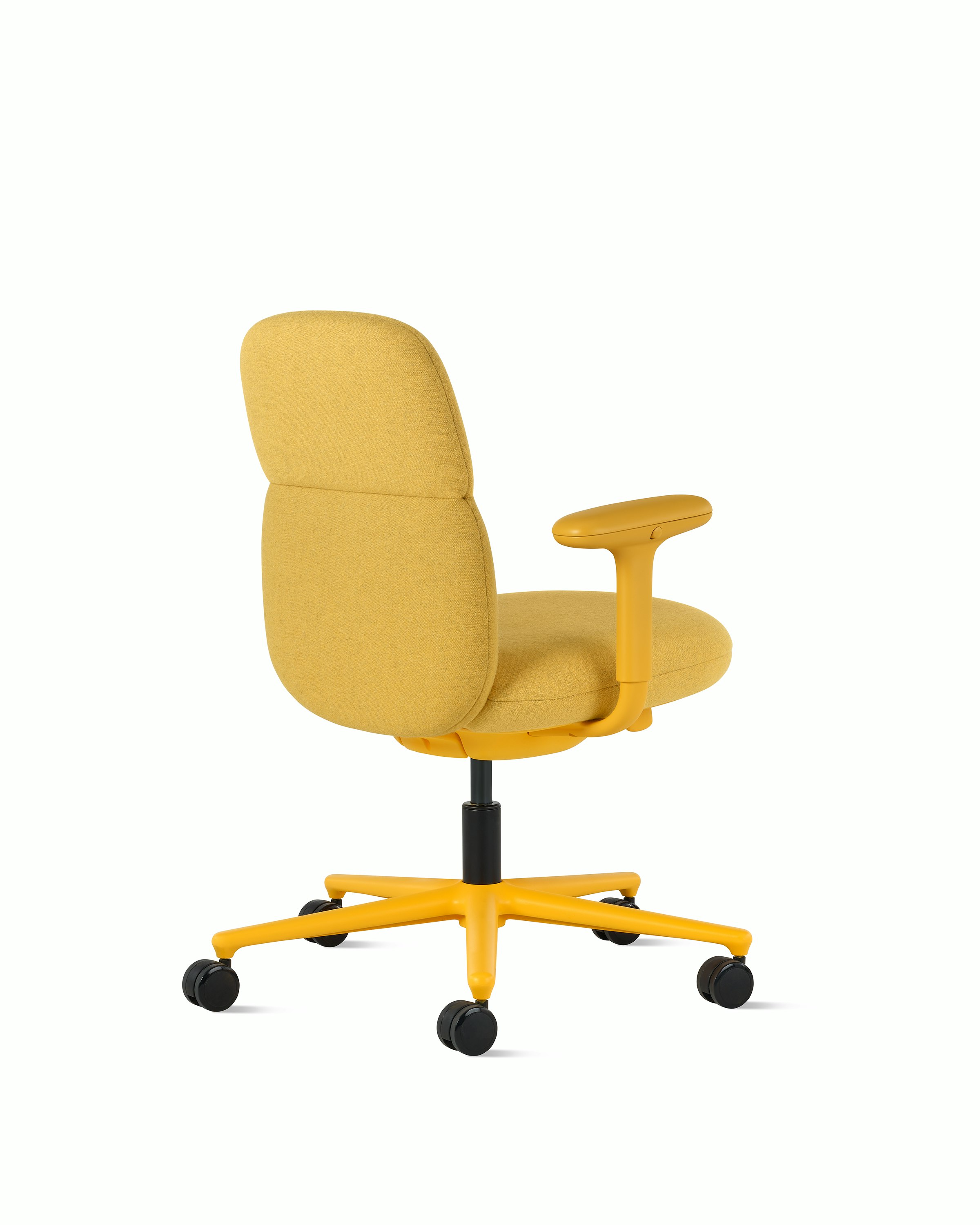 Rear angle view of a mid-back Asari chair by Herman Miller in yellow with height adjustable arms.