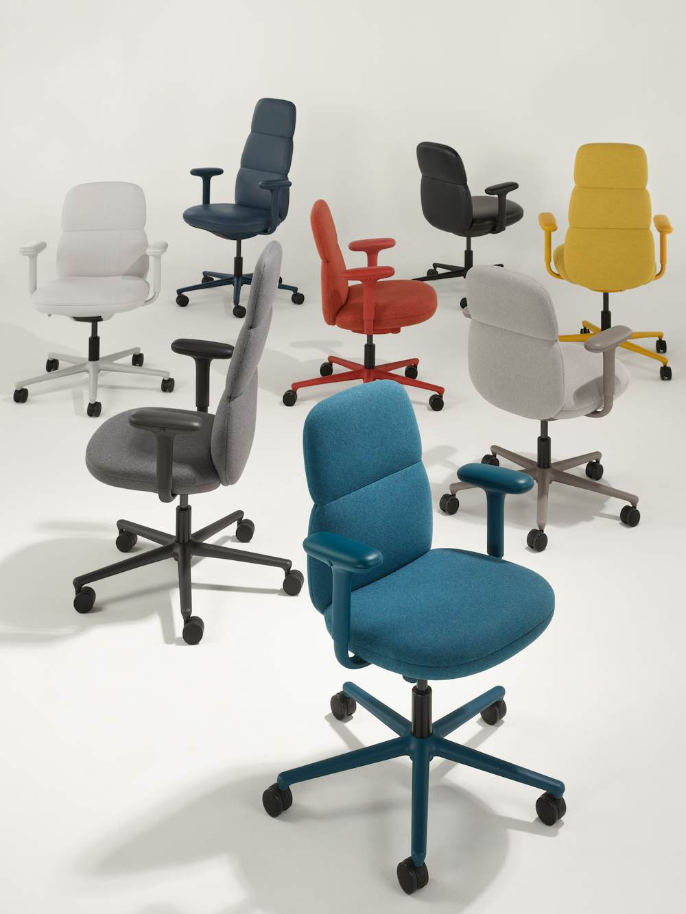 A group of eight Asari chairs by Herman Miller with height adjustable arms in all available color flood options. There are five high-back chairs and three mid-back chairs.