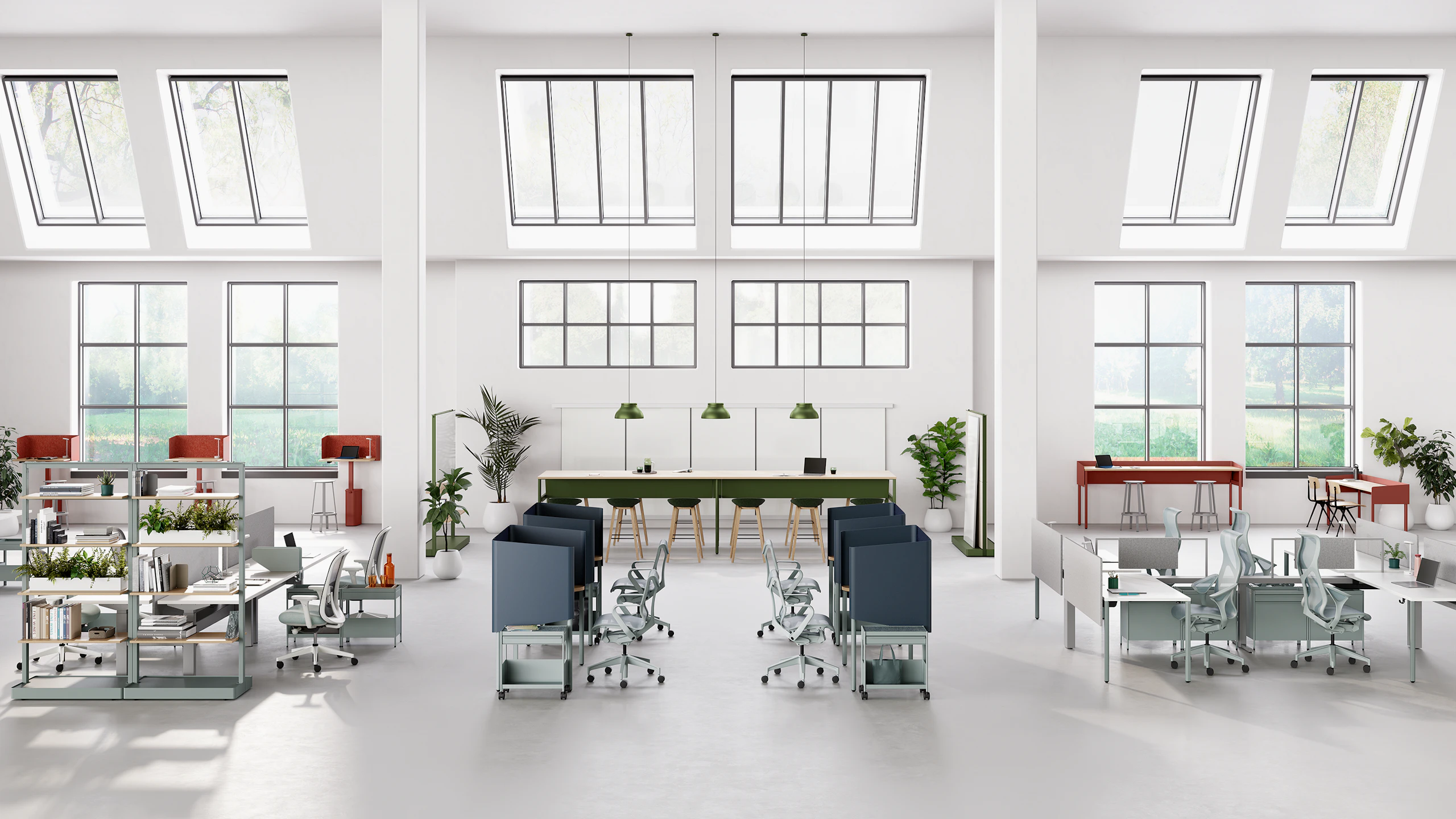 Open floor workspace with various OE1 Workspace Collection products in red, green and blue.
