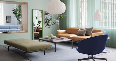 A sofa, upholstered bench, and chair arranged around a coffee table at the Muuto showroom at 251 Park Avenue South in New York City