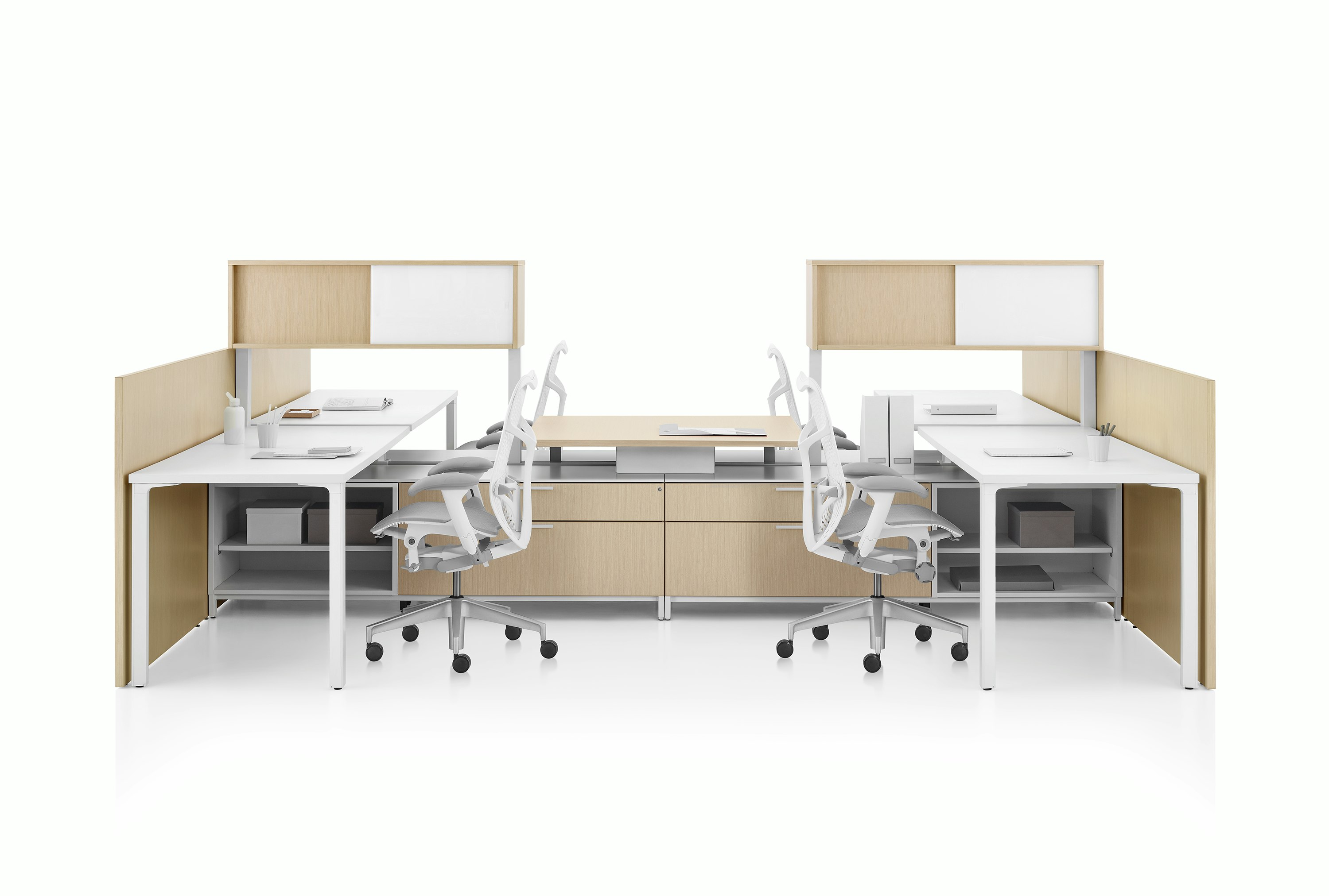 Canvas Dock workstation with white surfaces and light brown storage.