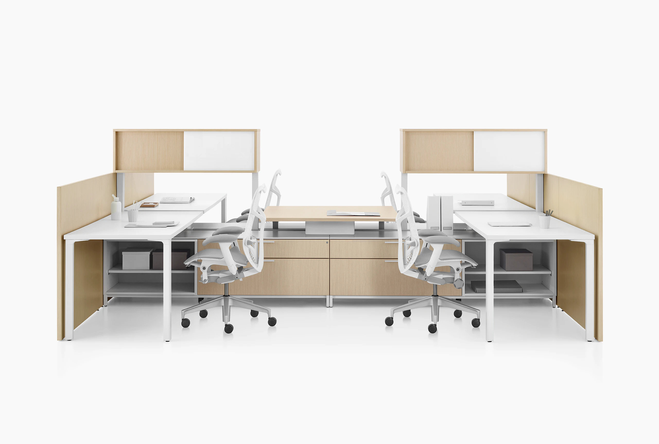 Canvas Dock workstation with white surfaces and light brown storage.