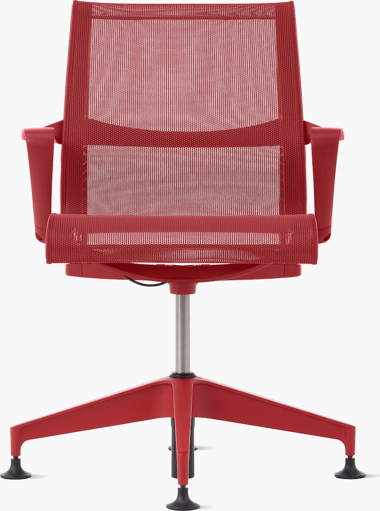 Front view of a Setu side chair with fixed arms in red.