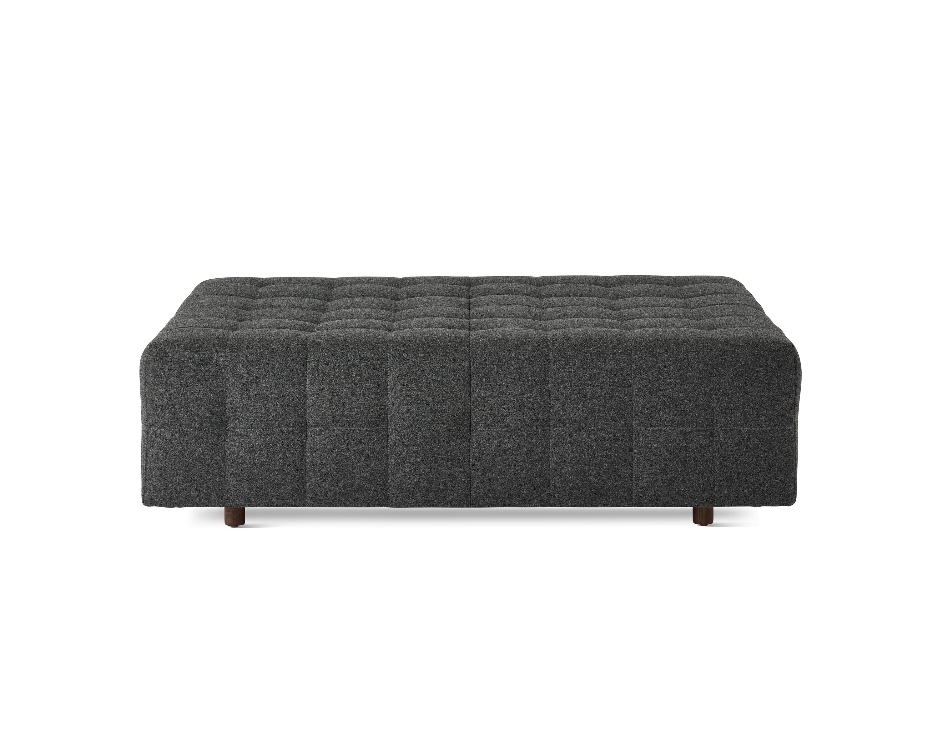 A Rapport ottoman upholstered in a dark grey fabric.