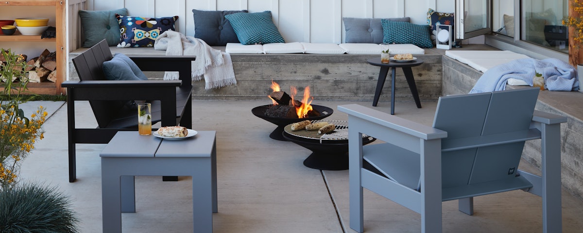 Cast-Iron Fire Bowls, Hennepin Two Seater Sofa and Hennepin Lounge Chair in outdoor patio setting