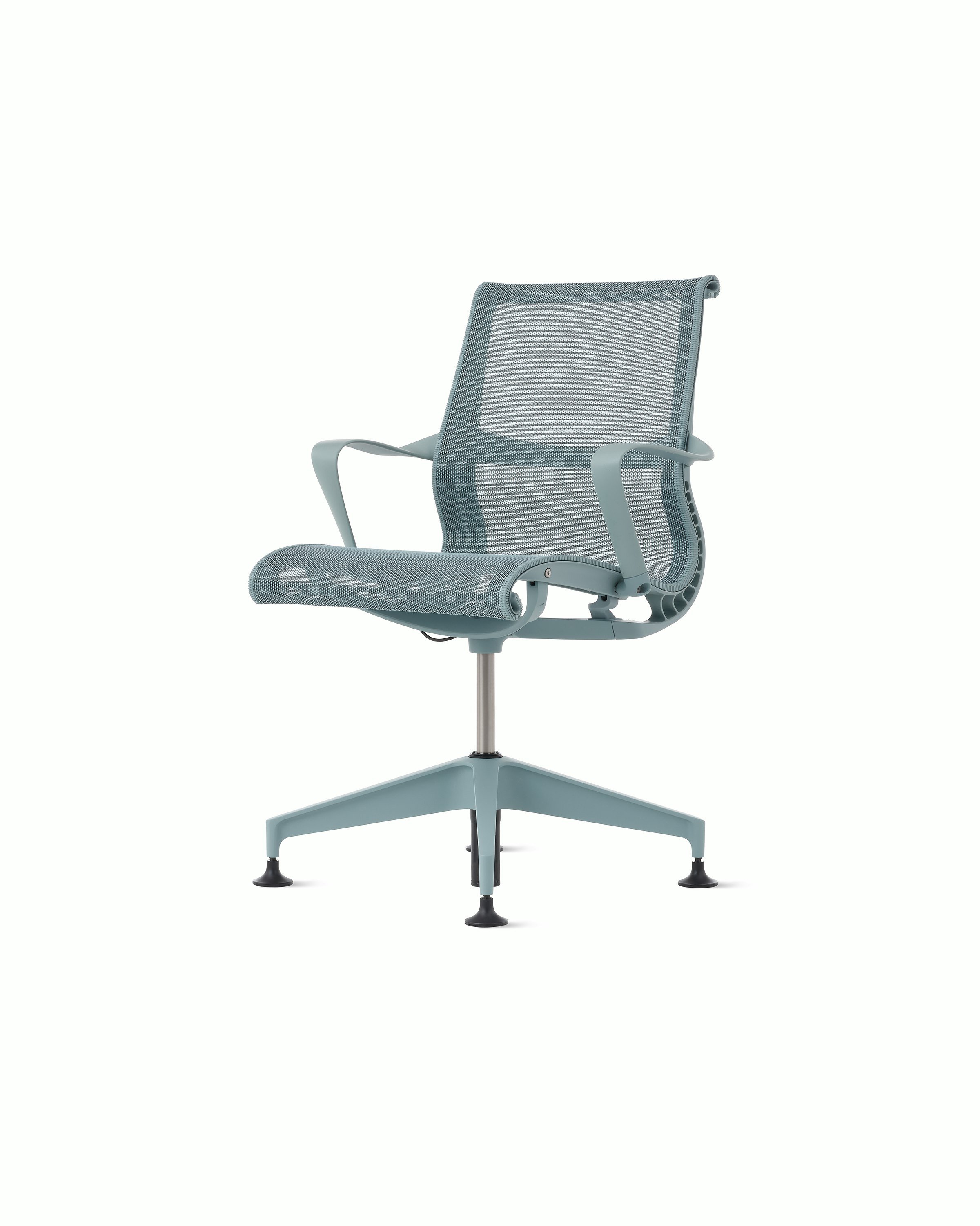 Front angle view of a Setu side chair with fixed arms in light blue.