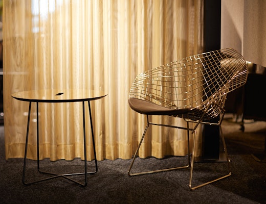 Bertoia Diamond Chair with Occasional Table neocon showroom 2017 immersive planning bertoia diamond chair gold rockwell unscripted occasional table