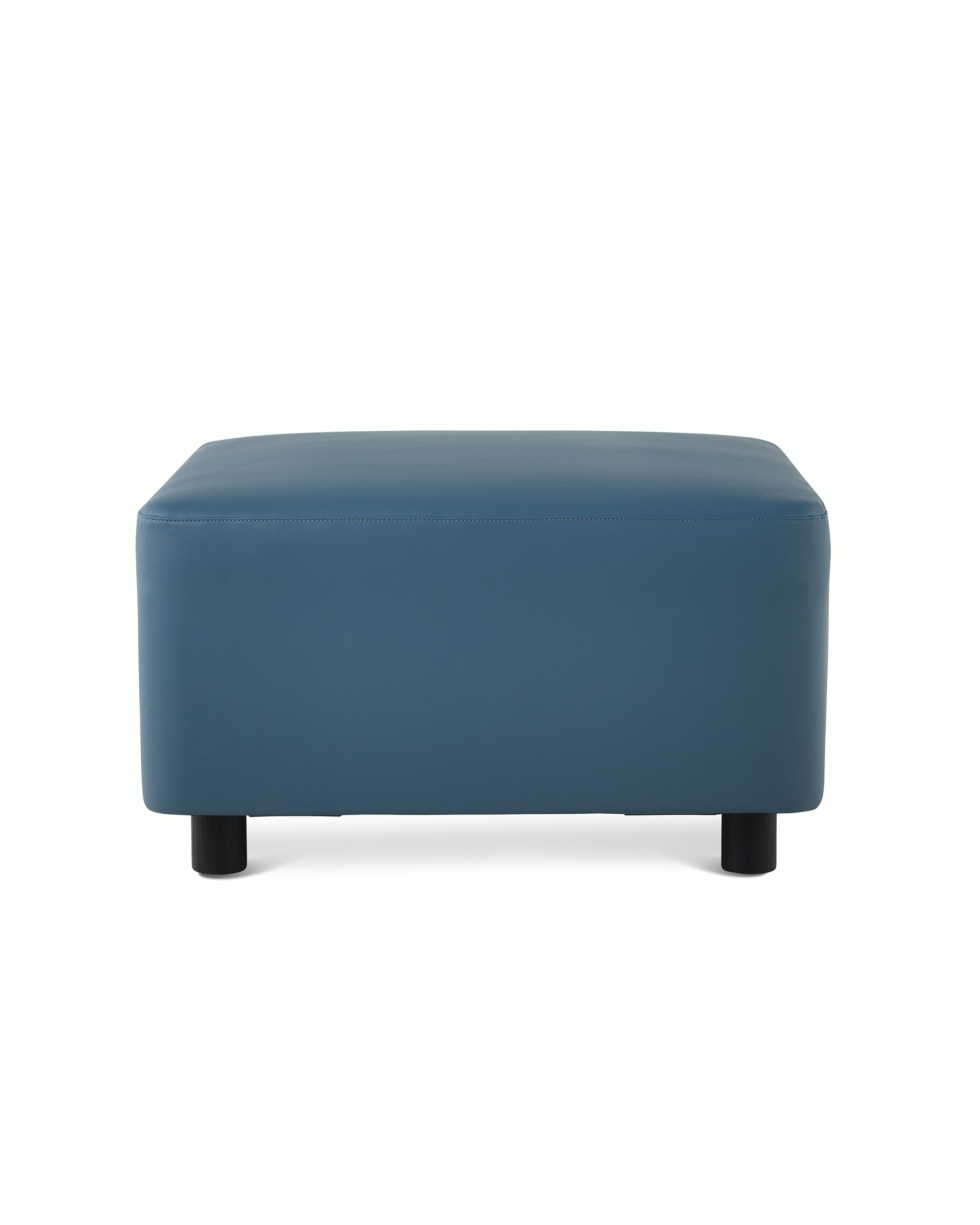 A Plex Ottoman in a blue upholstery.