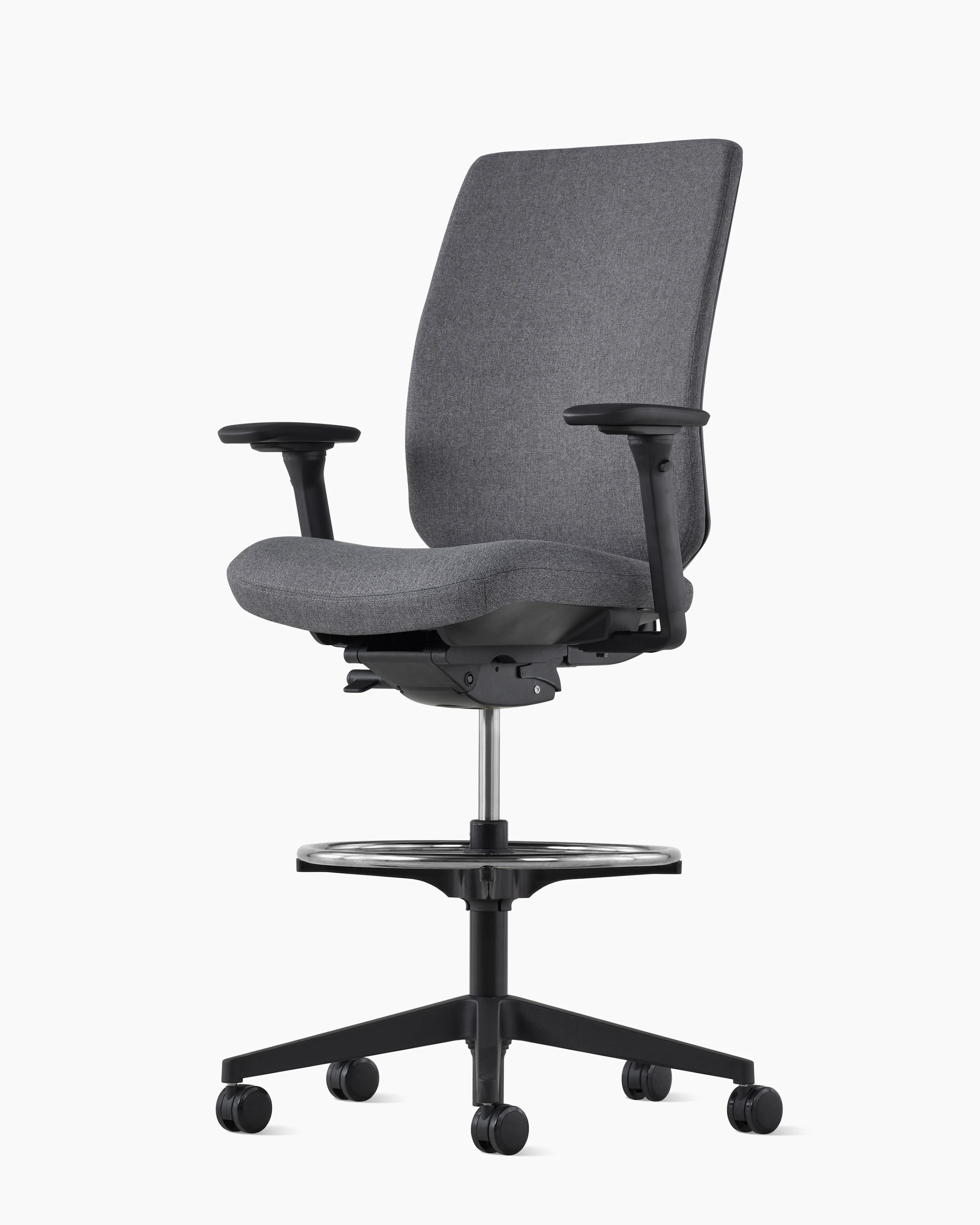 A black Verus Stool with an upholstered back, viewed at an angle.