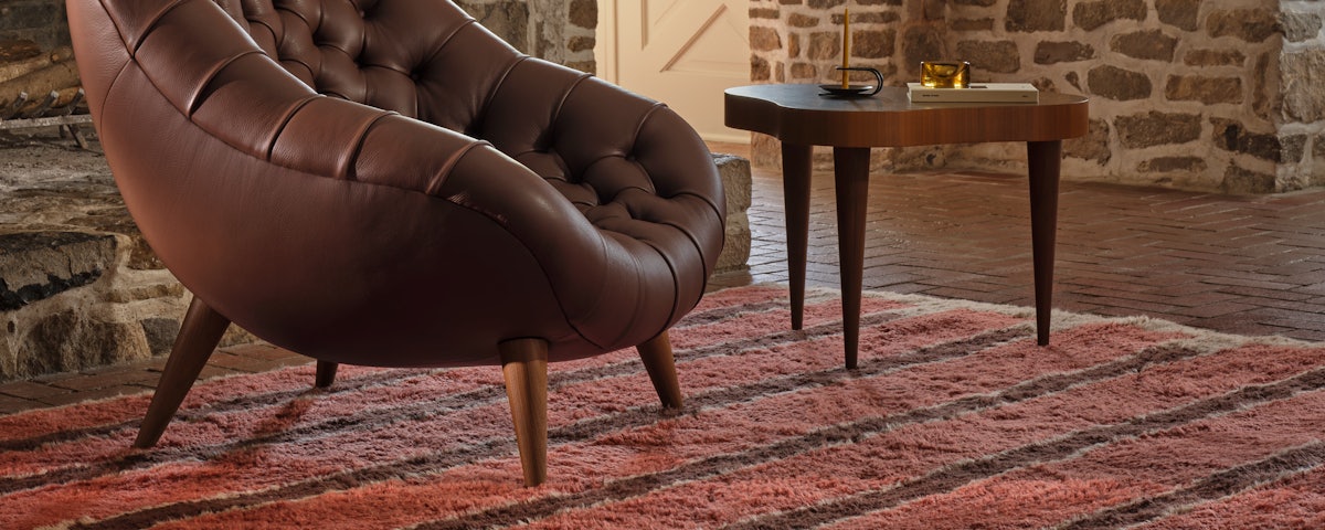 Brick Wool Moroccan Rug under a Rohde Tufted Chair in a living room setting