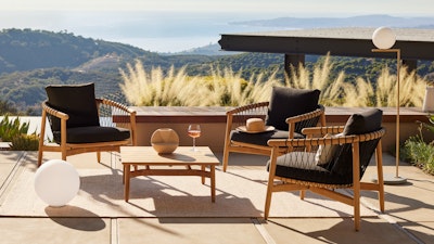 Crosshatch Outdoor Lounge Chairs and Square Coffee Table in an environmental setting overlooking mountain and ocean views.