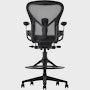 Black matte Aeron Stool on a white background with a 5-star base and ergonomic back support, view of the chair back.