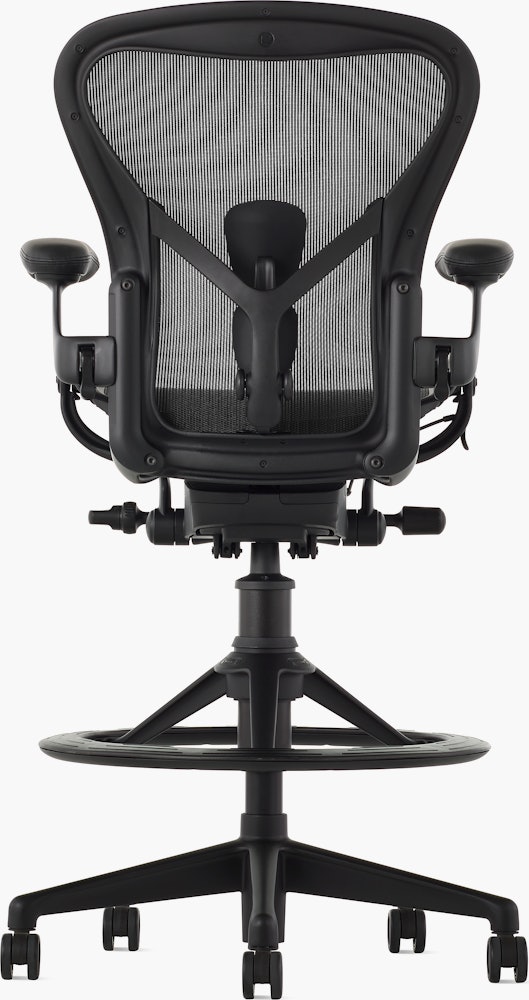Black matte Aeron Stool on a white background with a 5-star base and ergonomic back support, view of the chair back.