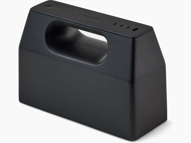 Black OE1 Power Pack viewed from an angle with four green charge indicator lights illuminated.