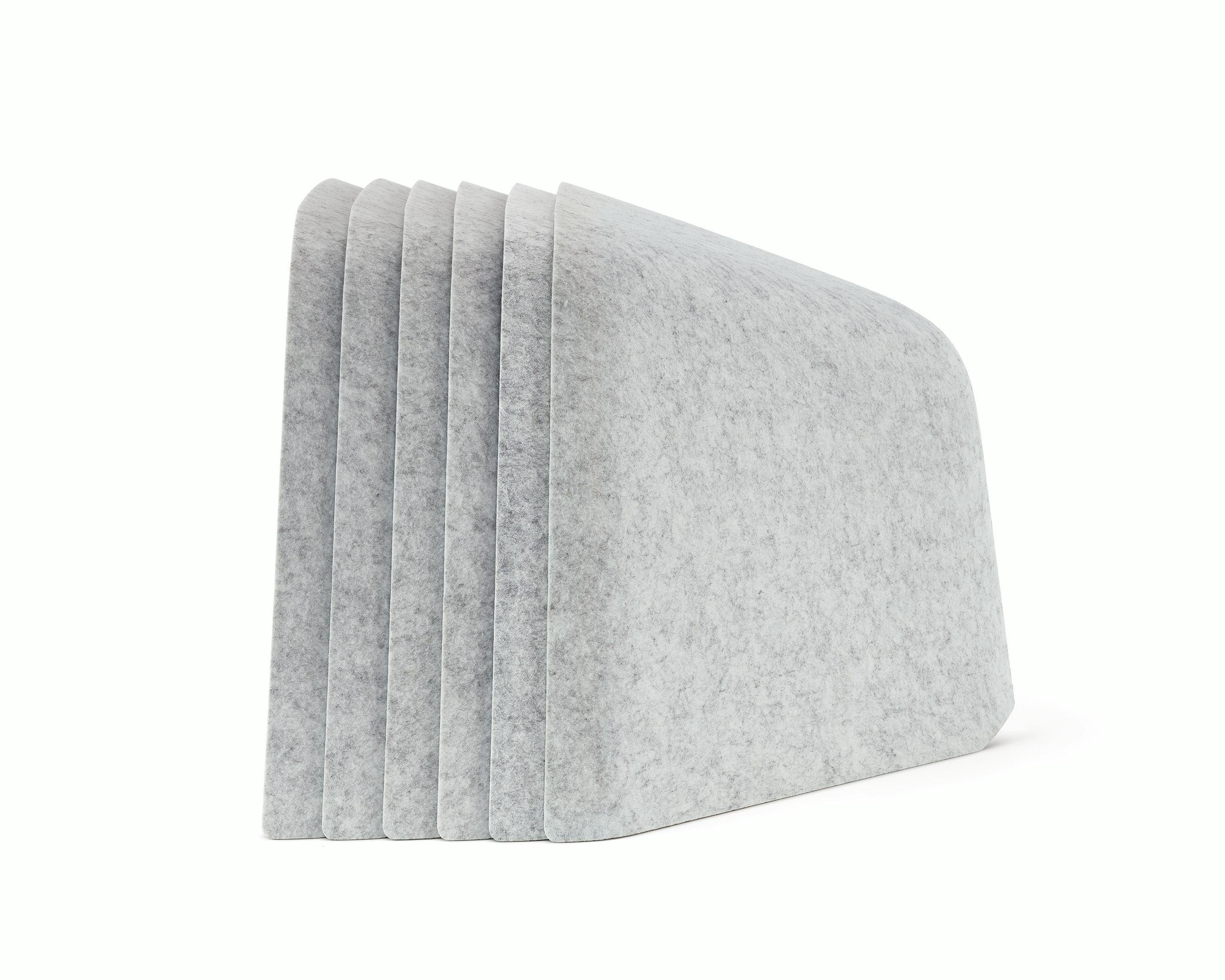 Six grey OE1 Personal Hoodies stacked together, viewed from the side.