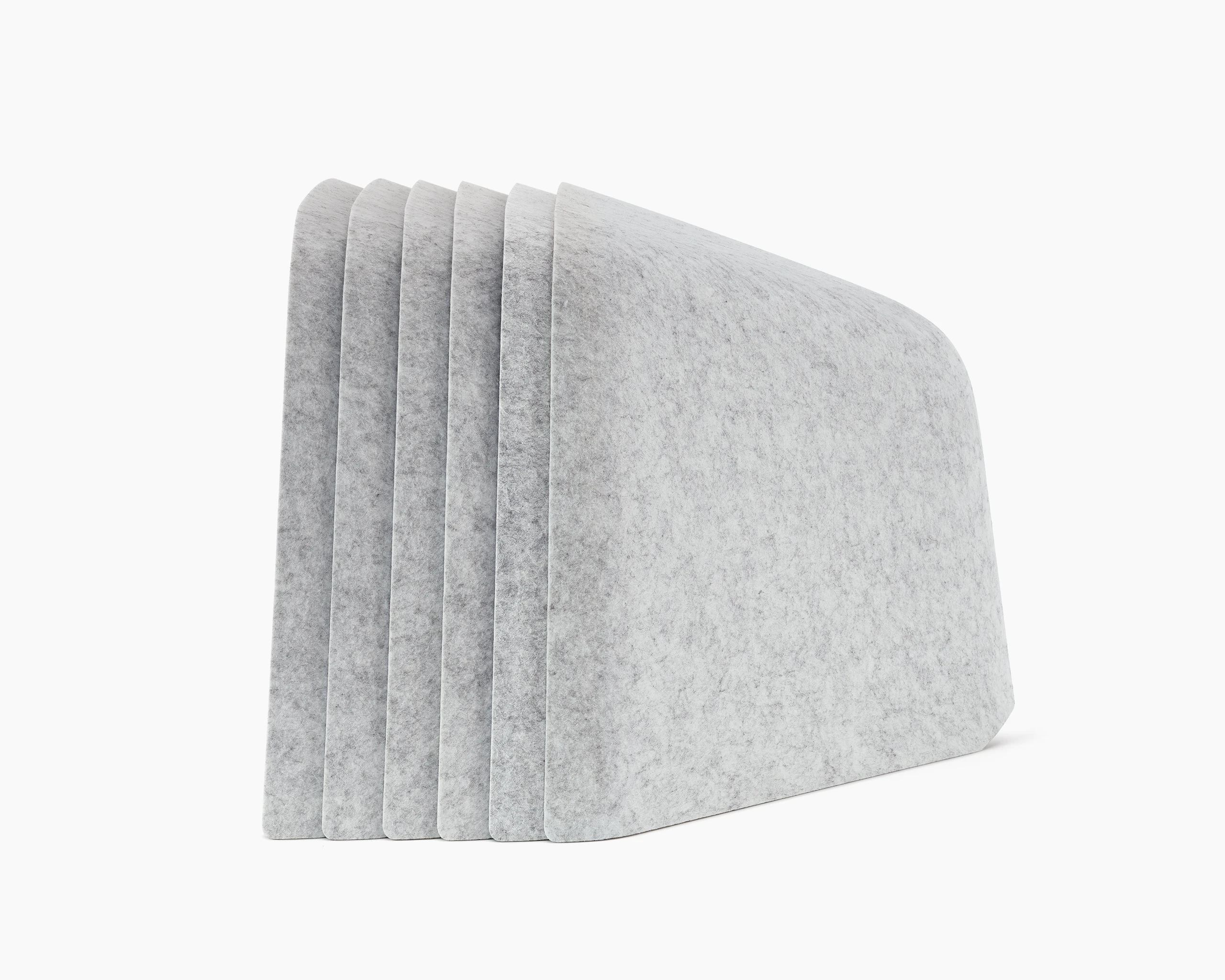 Six grey OE1 Personal Hoodies stacked together, viewed from the side.