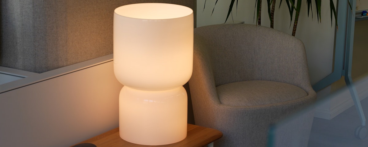 Closeup of a Totem Table Lamp on a sofa table