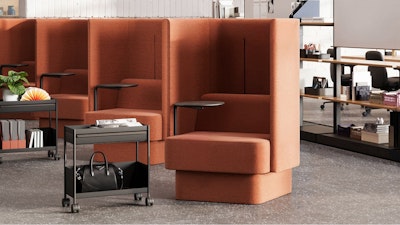 A bank of burnt-orange NaughtOne Pullman chairs next to Herman Miller OE1 Storage Trolleys in an individual study hall setting designed to cultivate an area of focus and wellbeing