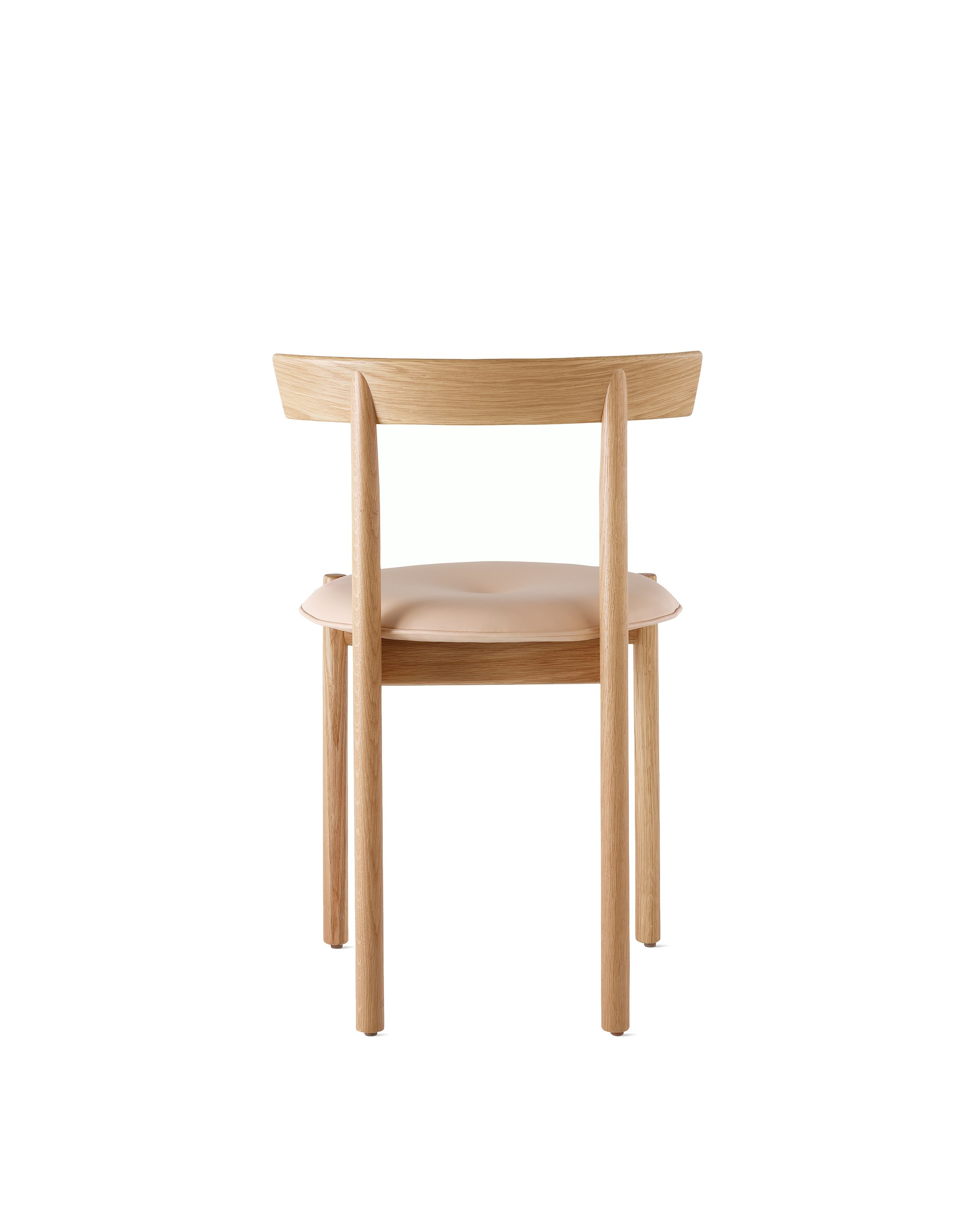 An oak Comma Chair with a seat pad, viewed from the back.