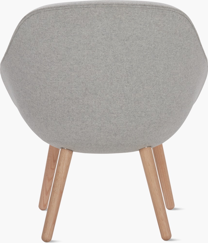A light grey About a Lounge 82 Armchair with low back viewed from the back