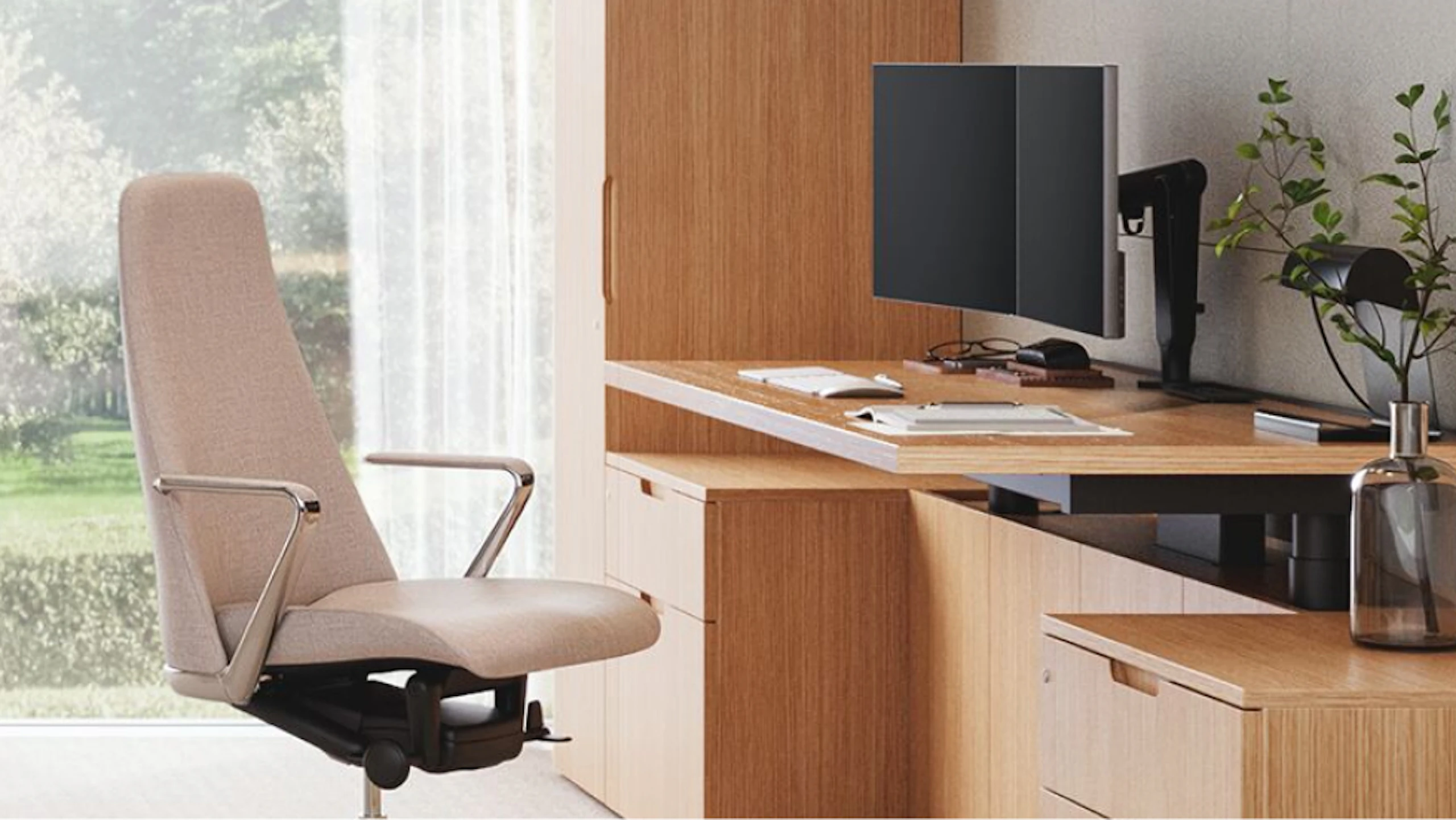 A white Geiger Taper chair at a computer workstation in a private office setting designed to consider the wellbeing of individuals