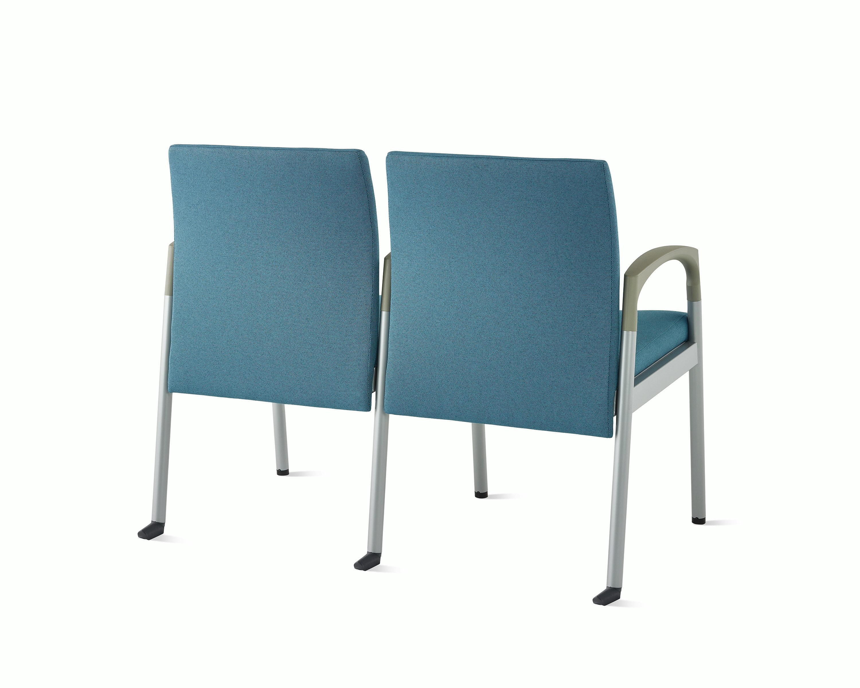 Three-quarter, back view of Valor two-seat multple seating with intervening arms and legs in a blue upholstery, silver frame, and pewter armcaps on white sweep.