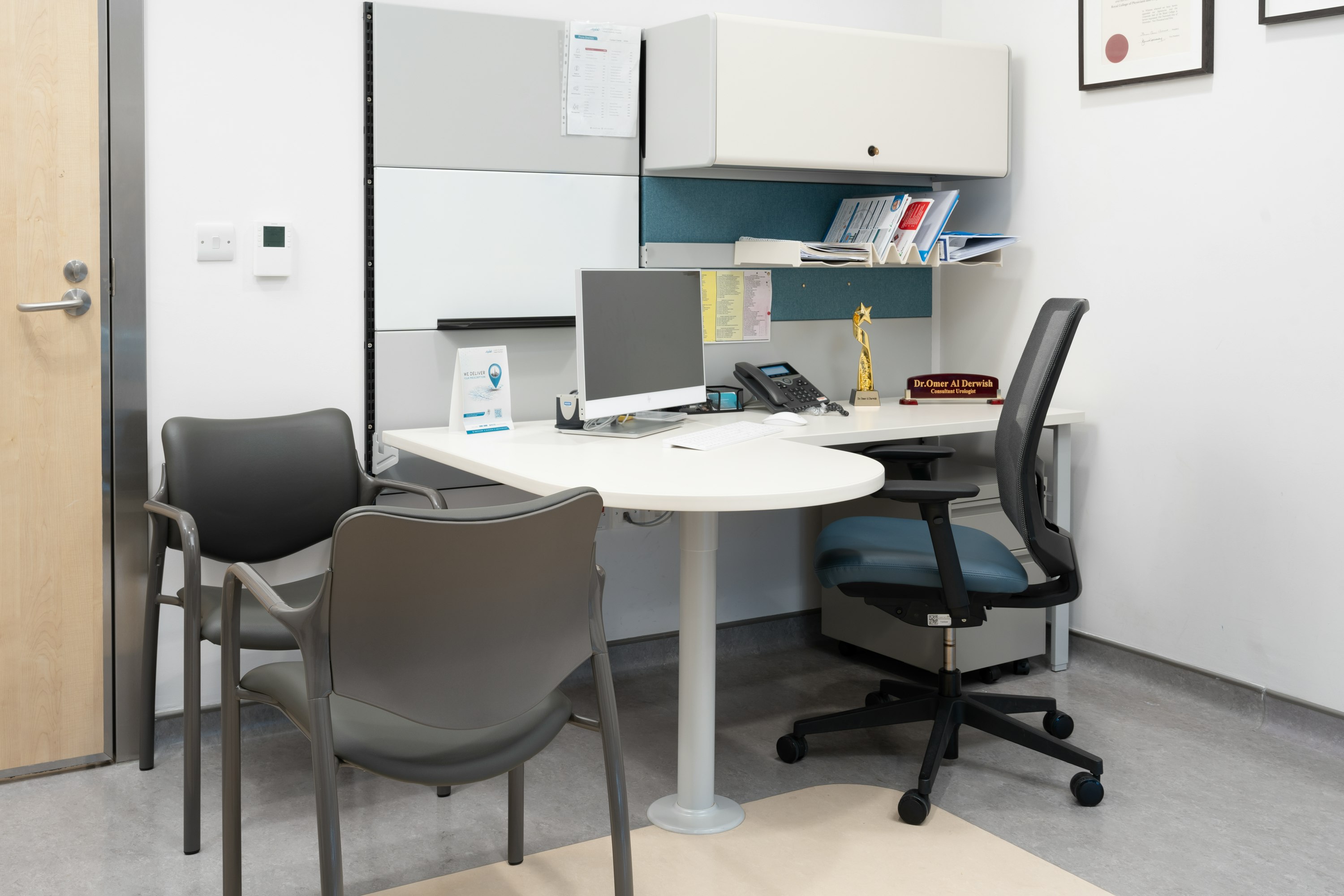 Ethospace Wall mounted rectangular workstation on wall strips with Express 2 chair with Vinyl seat and Aside chairs.