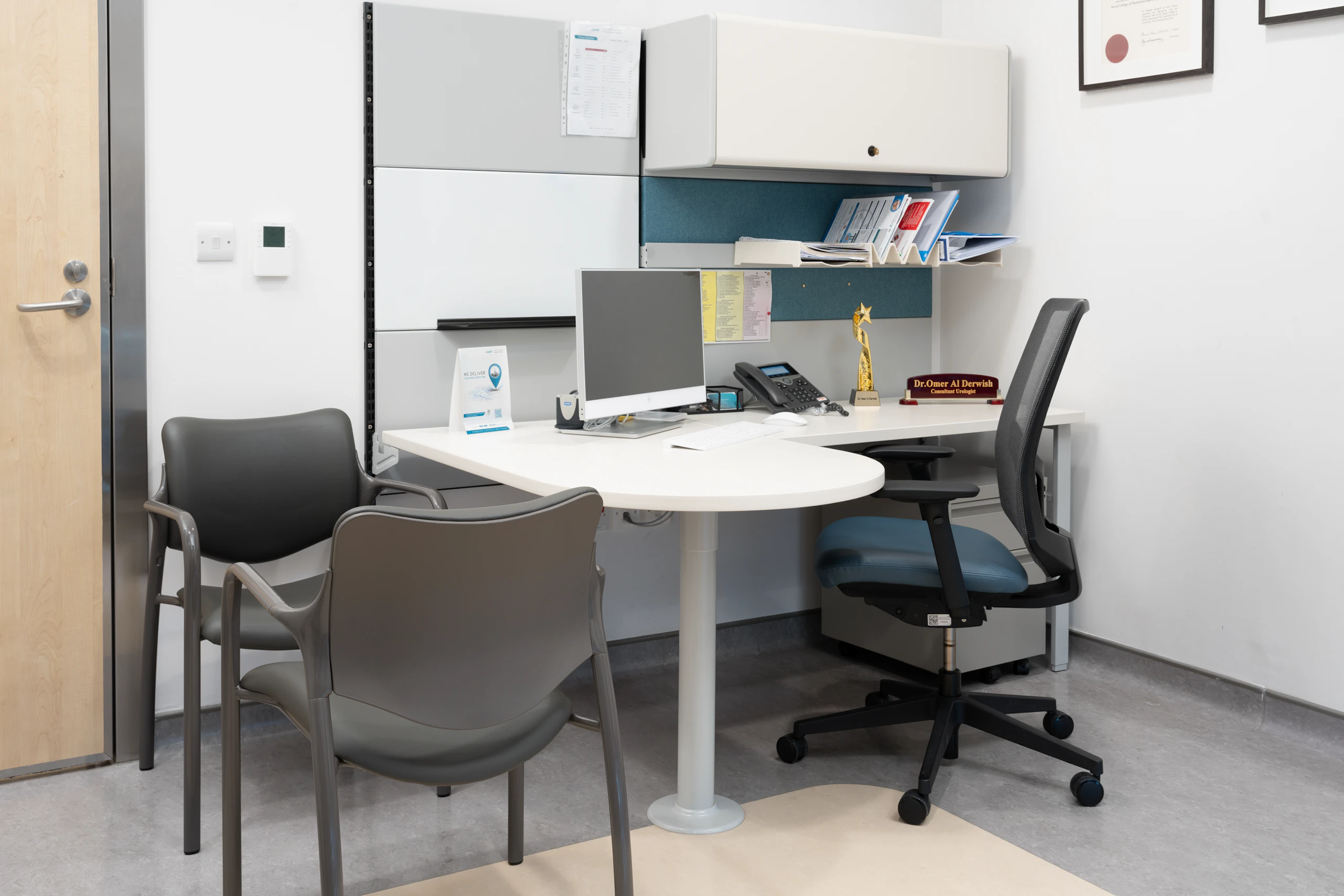 Ethospace Wall mounted rectangular workstation on wall strips with Express 2 chair with Vinyl seat and Aside chairs.