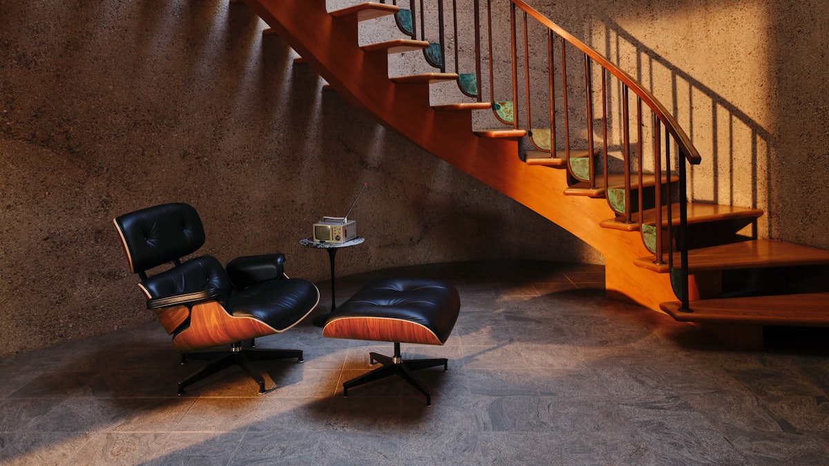 Eames Lounge and Ottoman at the foot of a staircase